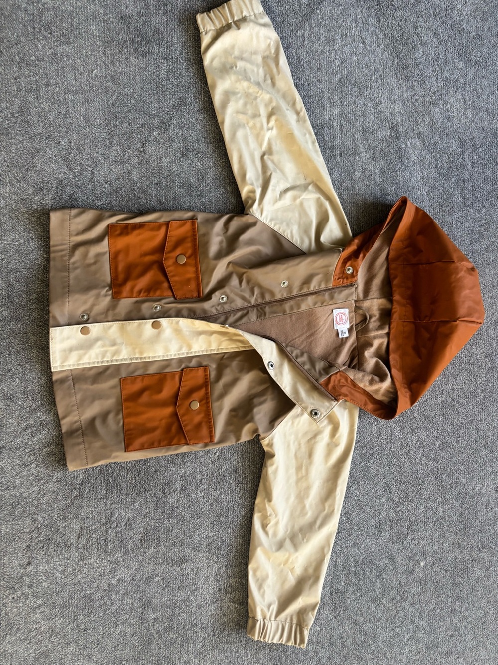 Two-Tone Hooded Rain Jacket in Brown and Cream with Rust Accents